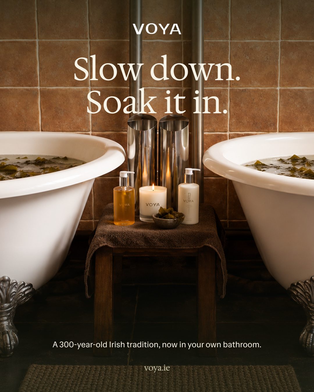 VOYA concept post: Slow down. Soak it in. Two seaweed baths either side of a candlelit stool with VOYA products